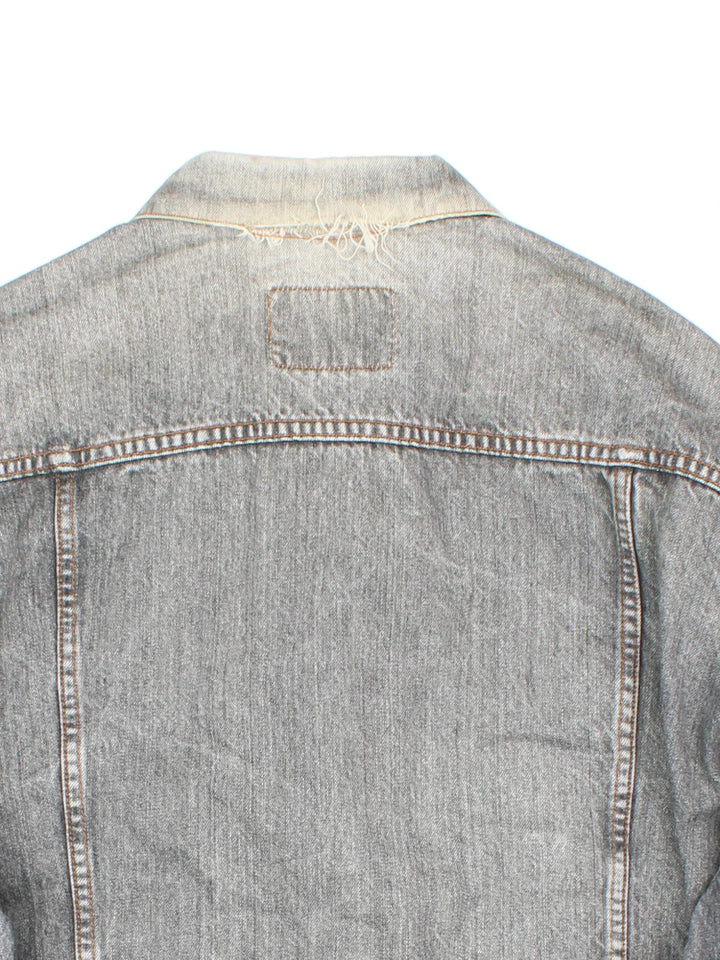 Vintage Levi Strauss Silver Tab Denim Jacket in a grey colourway. Buttons up and has multiple pockets, and the logo tab embroidered on the chest.