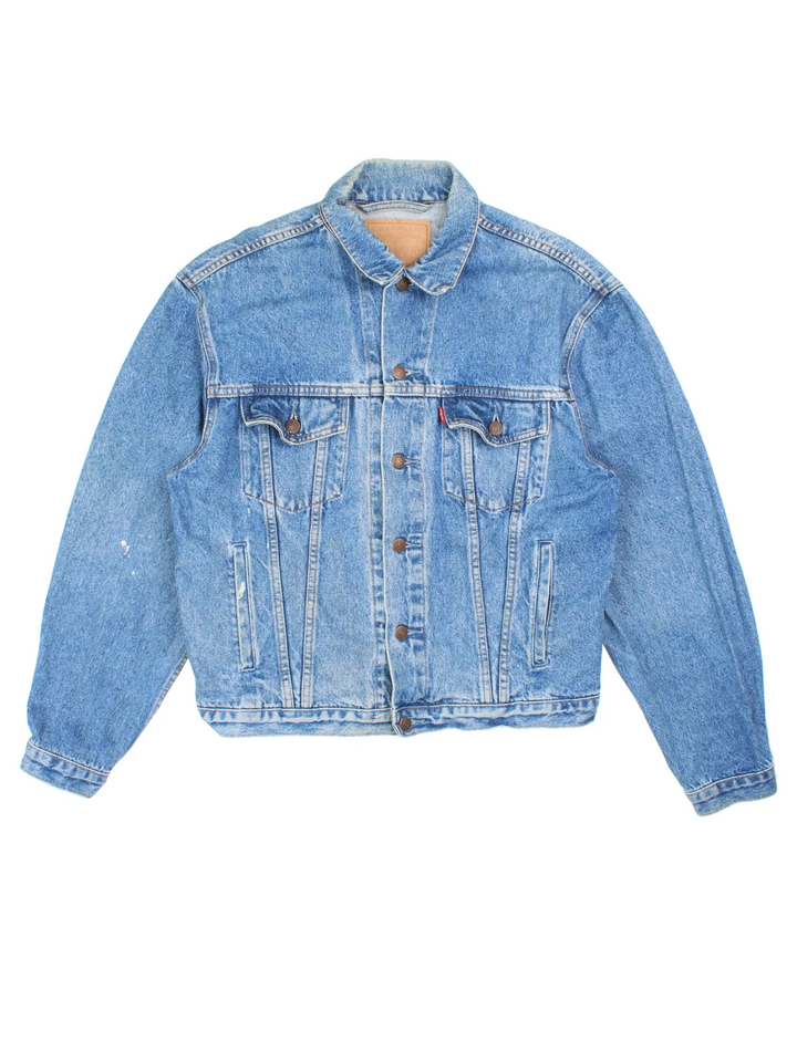Vintage Levi Strauss Denim Jacket in a blue colourway. Buttons up and has multiple pockets, and has the logo embroidered on the front.