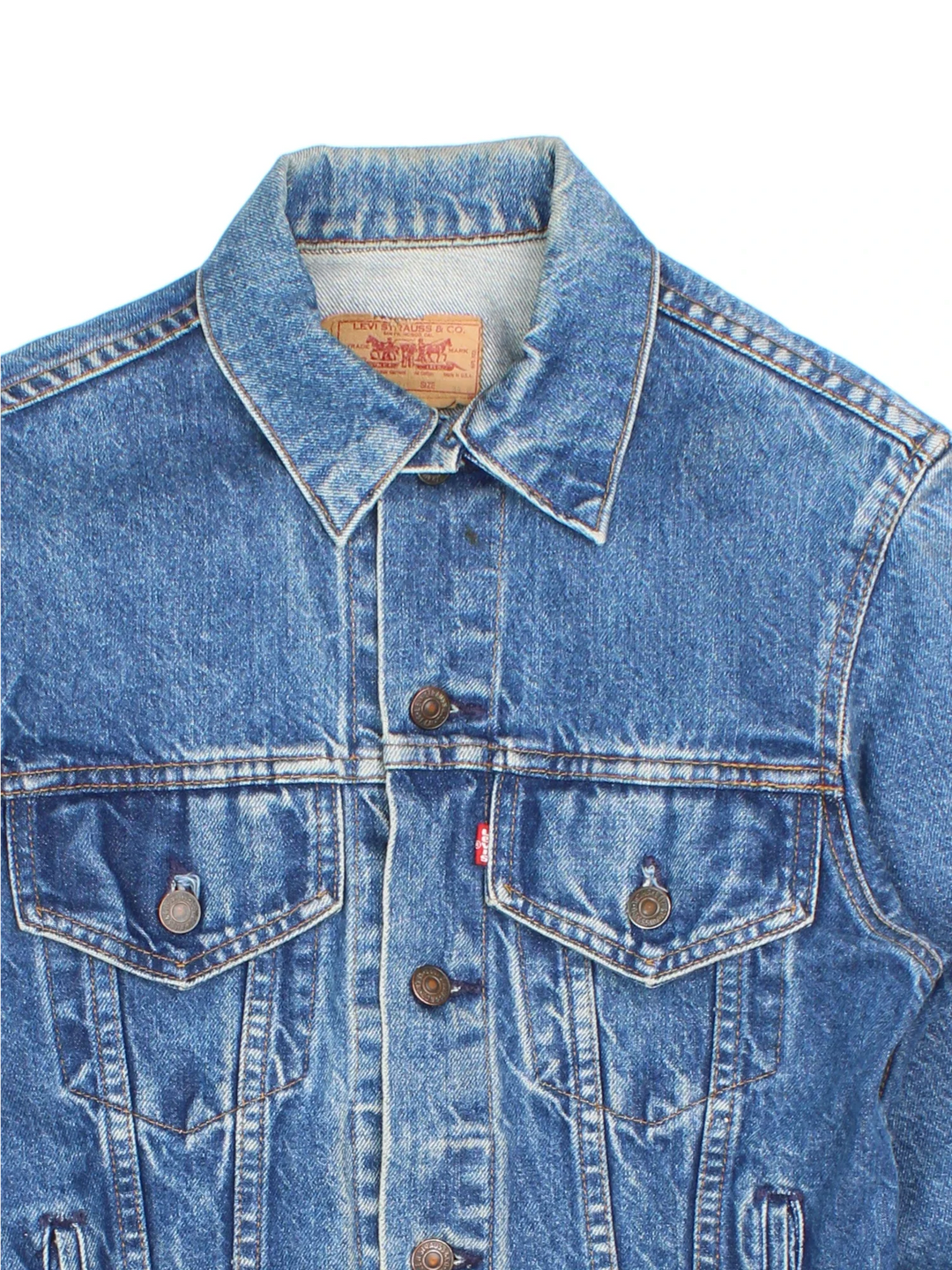 Vintage Levi Strauss Denim Jacket in a blue colourway. Buttons up and has multiple pockets, and has the logo embroidered on the front.