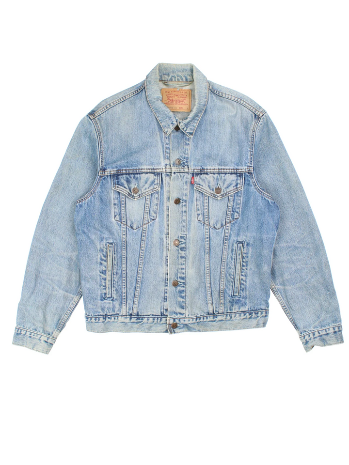 Vintage Levi Strauss Denim Jacket in a blue colourway. Buttons up and has multiple pockets, and has the logo embroidered on the front.