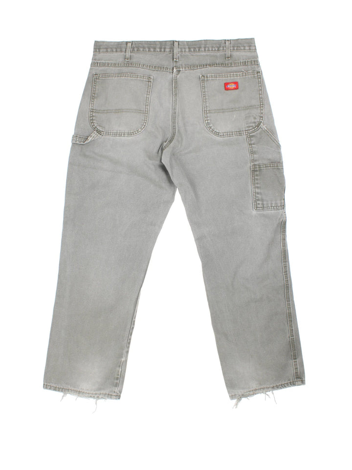 Dickies Carpenter Trousers in grey colourway with multiple pockets and the logo embroidered on the back.