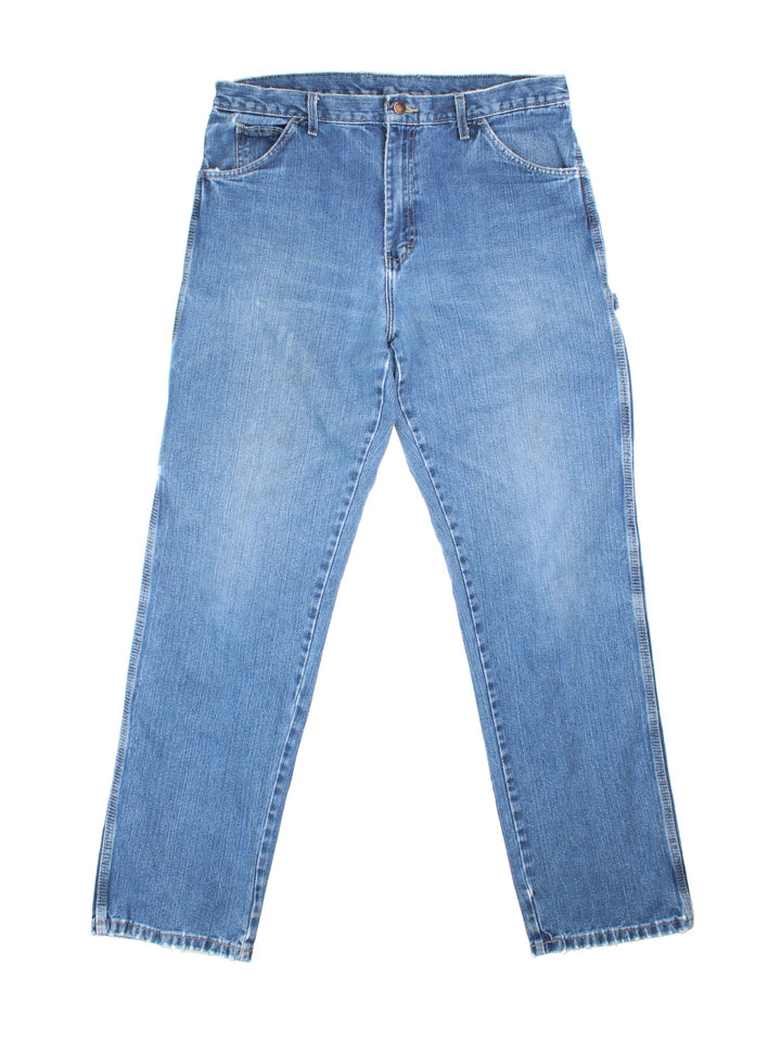 Dickies Carpenter Jeans in blue colourway with multiple pockets and the logo embroidered on the back.