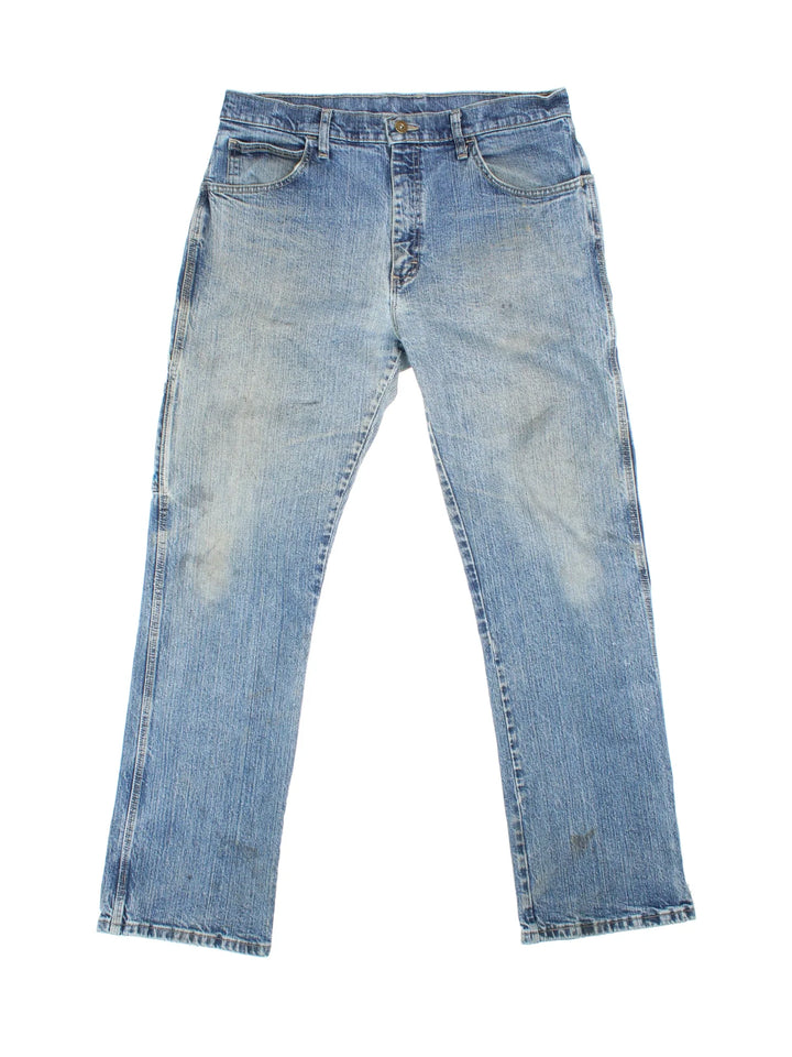 Dickies Jeans in blue colourway with multiple pockets and the logo embroidered on the back.