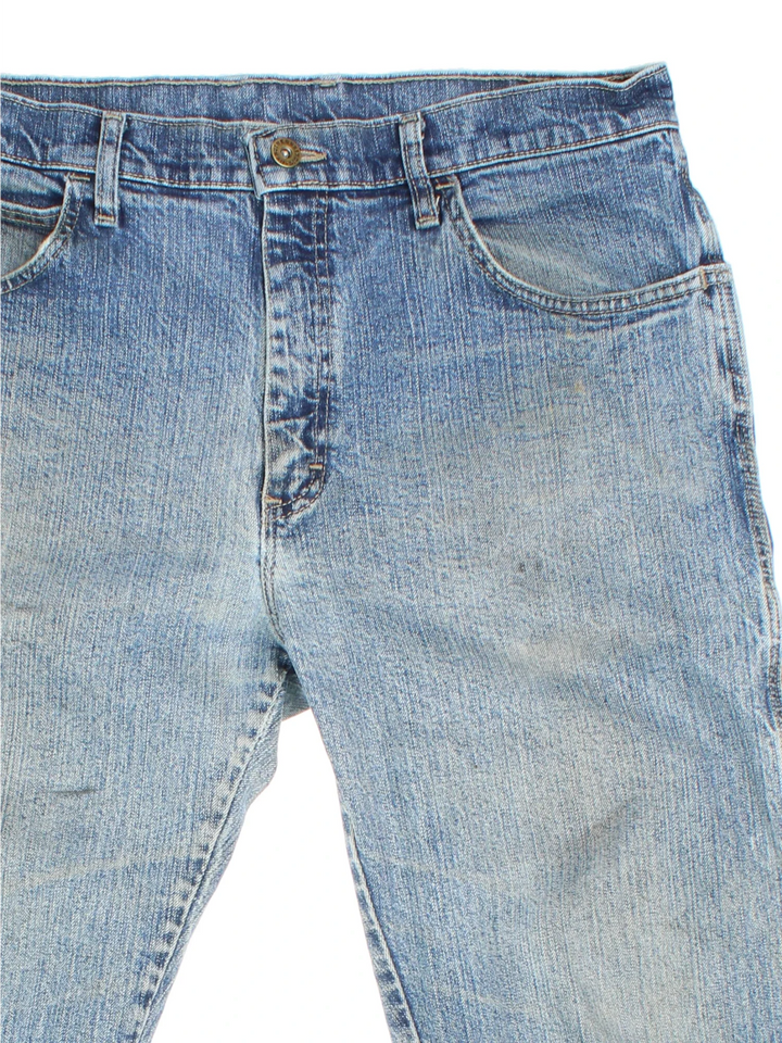 Dickies Jeans in blue colourway with multiple pockets and the logo embroidered on the back.