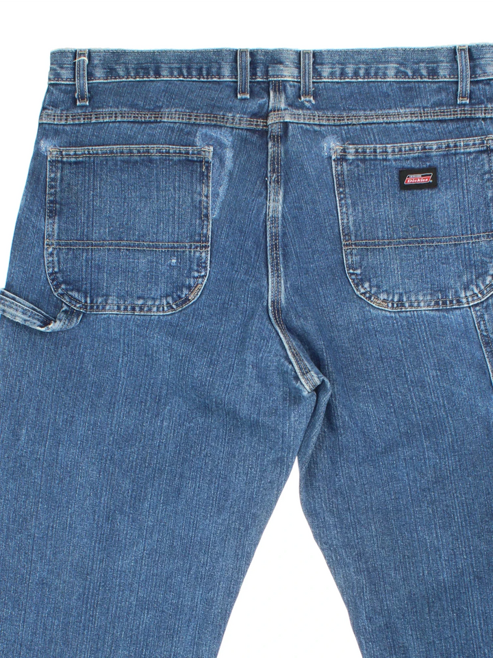 Dickies Jeans in blue colourway with multiple pockets and the logo embroidered on the back.