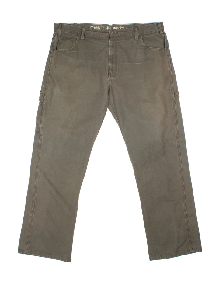 Dickies Carpenter Trousers in green colourway with multiple pockets and the logo embroidered on the back.