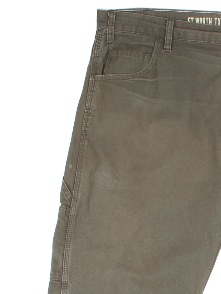 Dickies Carpenter Trousers in green colourway with multiple pockets and the logo embroidered on the back.