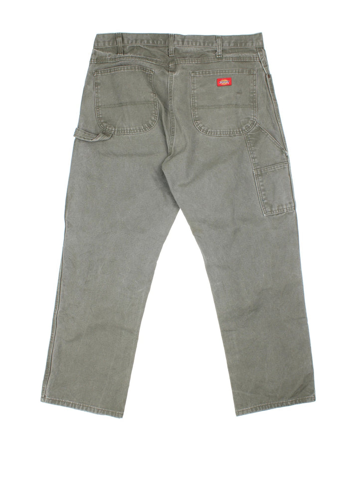 Dickies Carpenter Jeans in green colourway with multiple pockets and the logo embroidered on the back.