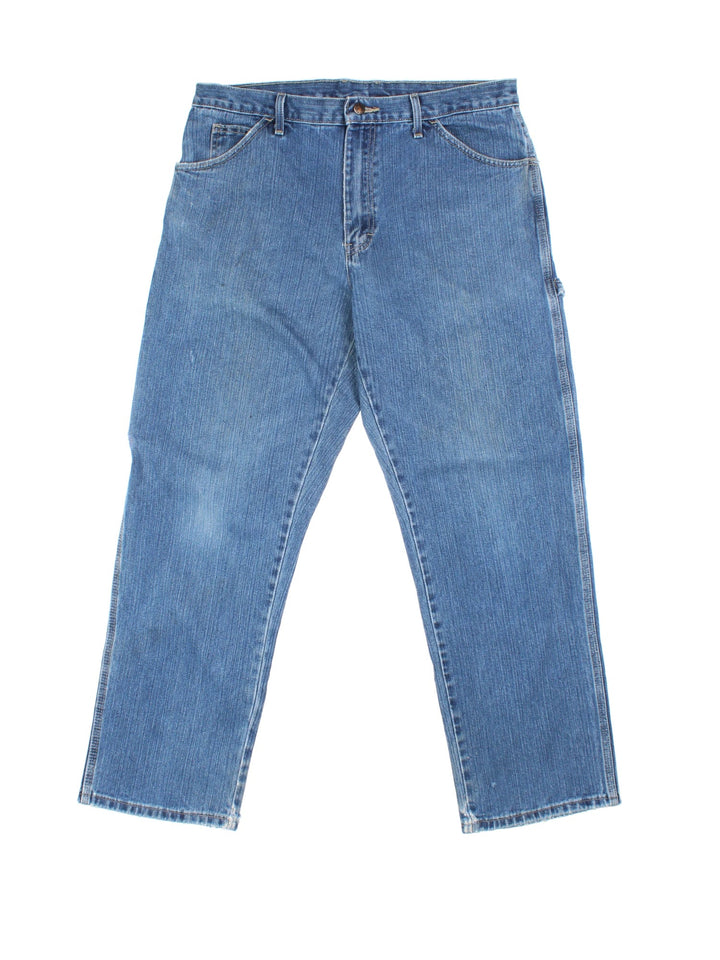 Dickies Carpenter Jeans in blue colourway with multiple pockets and the logo embroidered on the back.