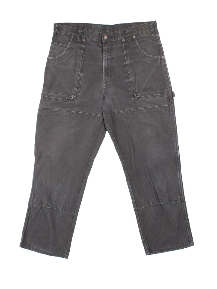 Dickies Carpenter Jeans in black colourway with multiple pockets and the logo embroidered on the back.