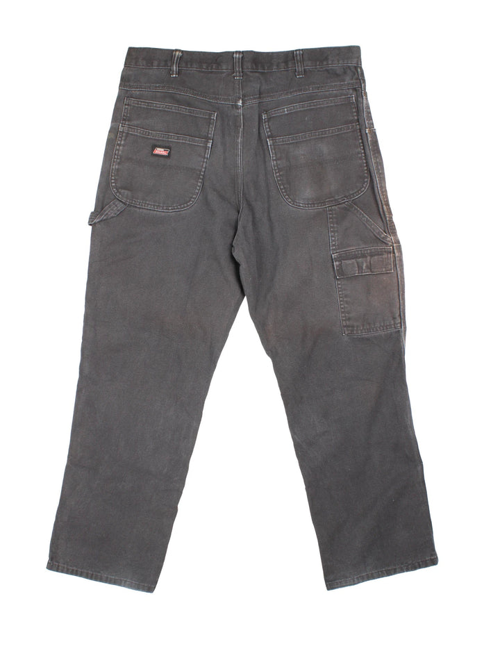 Dickies Carpenter Jeans in black colourway with multiple pockets and the logo embroidered on the back.