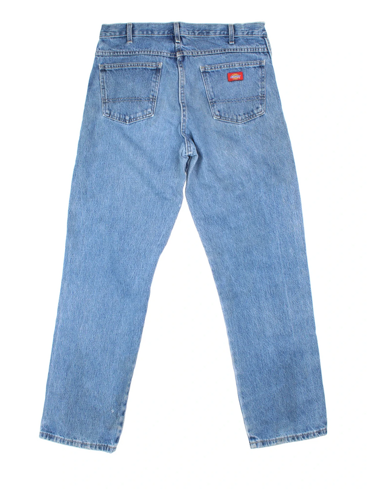 Dickies Jeans in blue colourway with multiple pockets and the logo embroidered on the back.