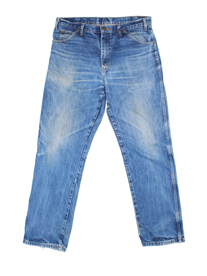 Dickies Jeans in blue colourway with multiple pockets and the logo embroidered on the back.