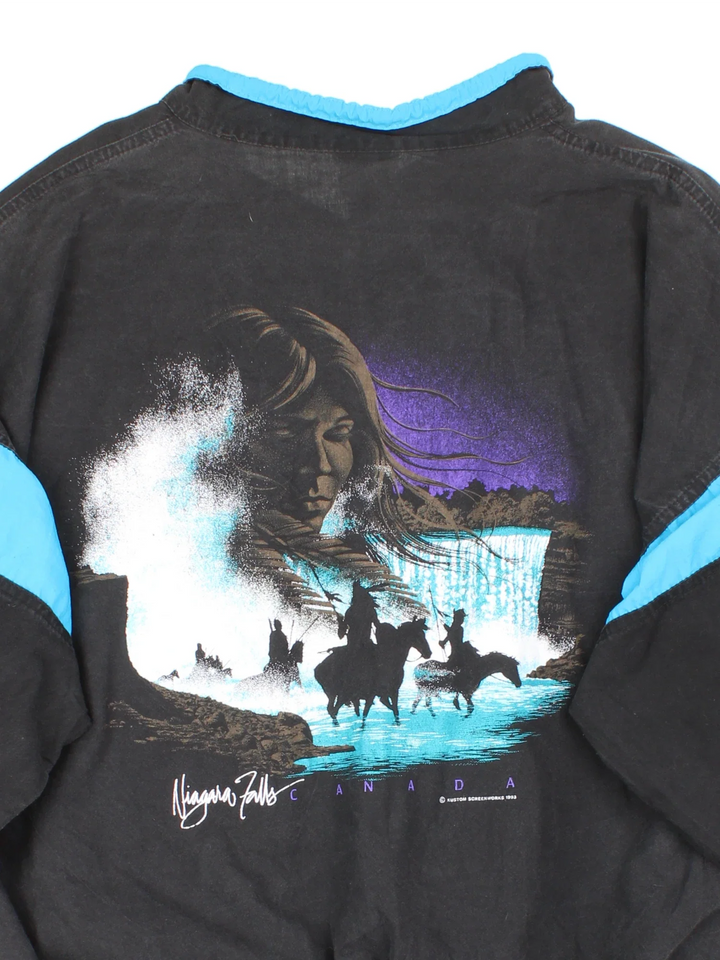 Vintage 1993 Jocky Mountain Windbreaker in a black colourway. Features contrast collar/panelling, and graphic embroidered on the front/printed on the back.