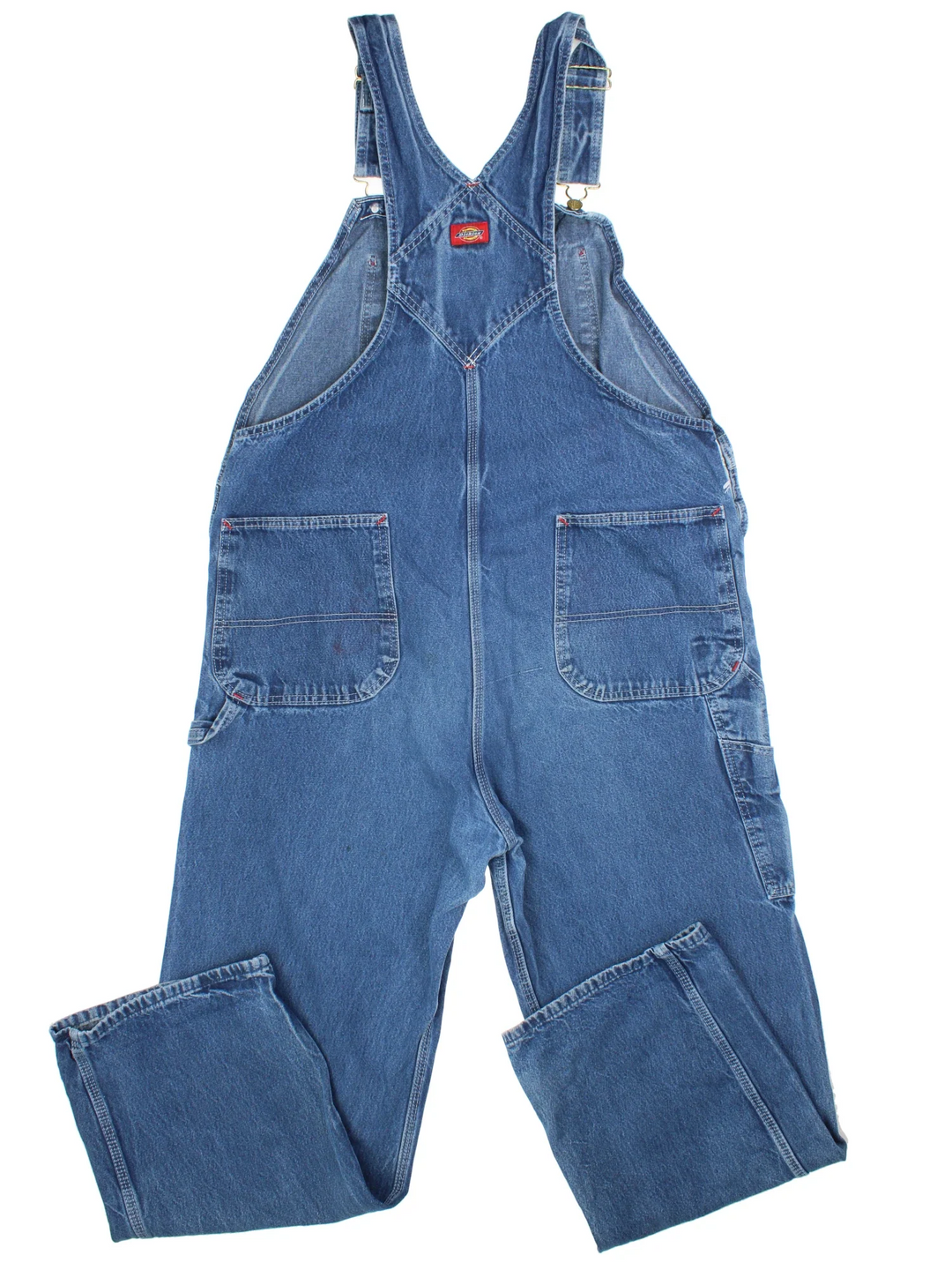 Dickies Denim Dungarees in a blue colourway with multiple pockets and the logo embroidered on the front.