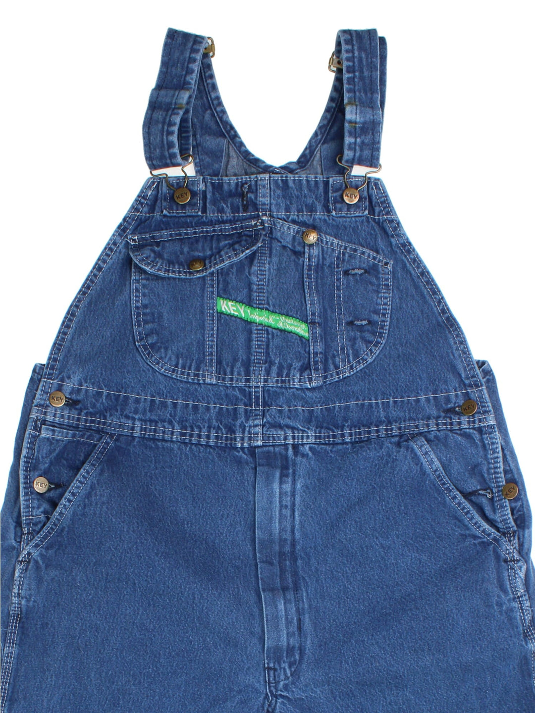 Vintage Key Imperial Dungarees in blue colourway with multiple pockets, adjustable straps, and has the logo embroidered on the front.