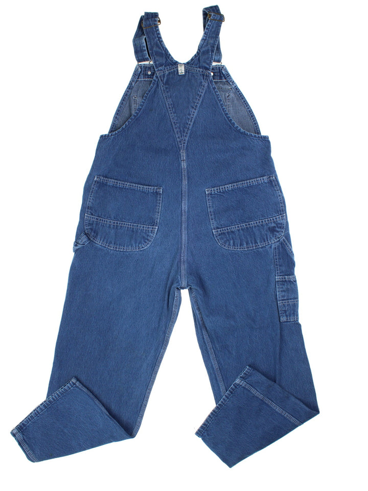 Vintage Key Imperial Dungarees in blue colourway with multiple pockets, adjustable straps, and has the logo embroidered on the front.