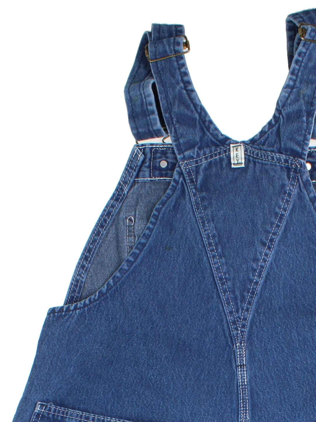 Vintage Key Imperial Dungarees in blue colourway with multiple pockets, adjustable straps, and has the logo embroidered on the front.