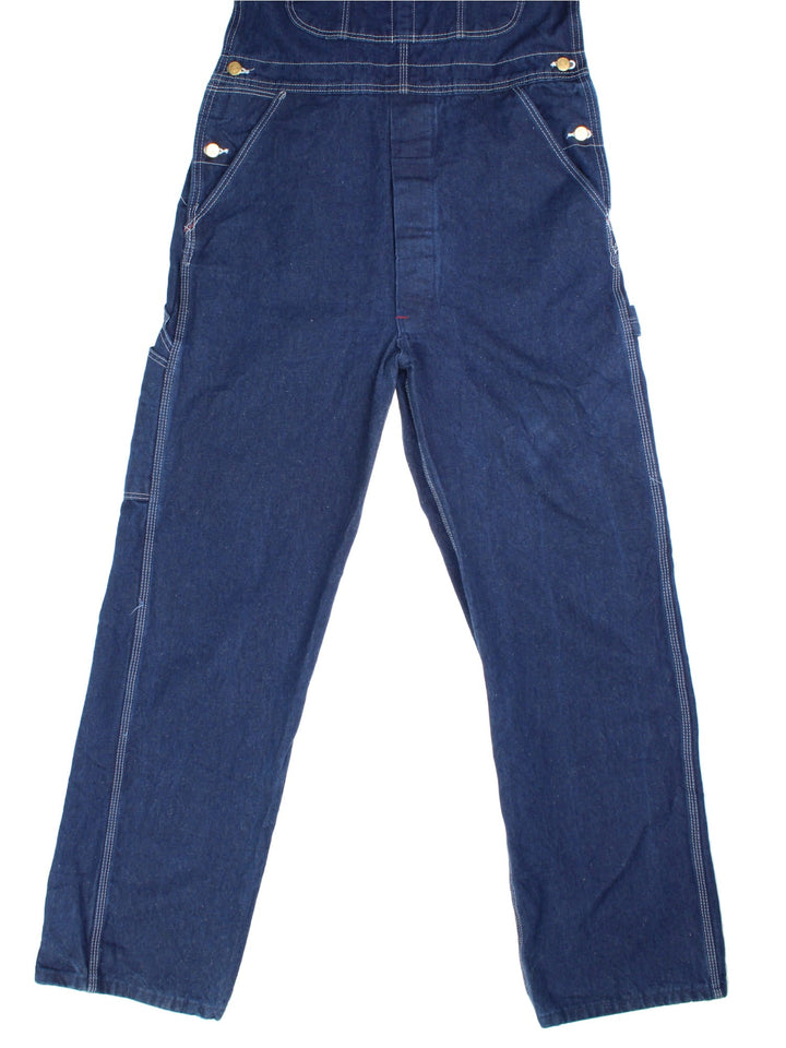 Dickies Dungarees in blue colourway with multiple pockets, adjustable straps, and has the logo embroidered on the front.