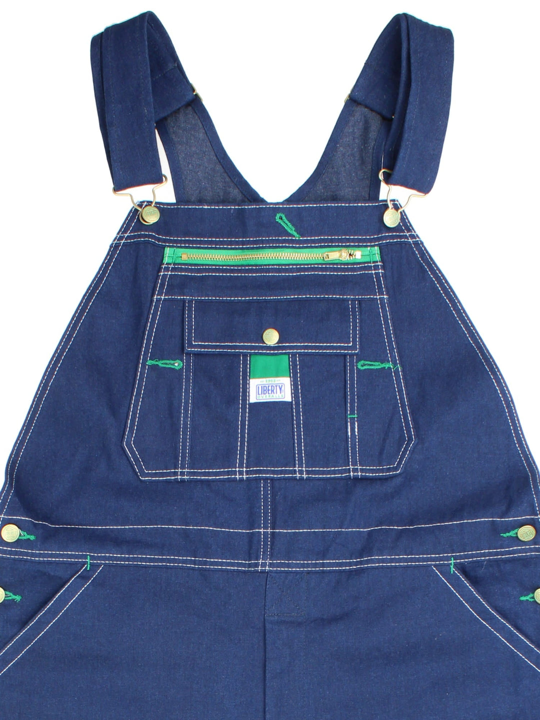 Vintage Liberty Dungarees in blue colourway with multiple pockets, adjustable straps, and the logo embroidered on the front.