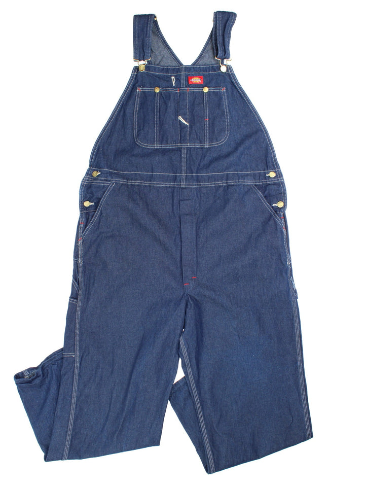 Dickies Dungarees in blue colourway with multiple pockets, adjustable straps, and the logo embroidered on the front.
