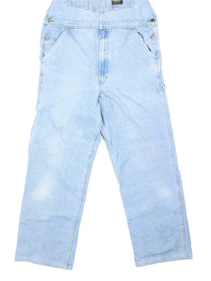 Osh Kosh Dungarees in blue colourway with multiple pockets, adjustable straps and the logo embroidered on the front.