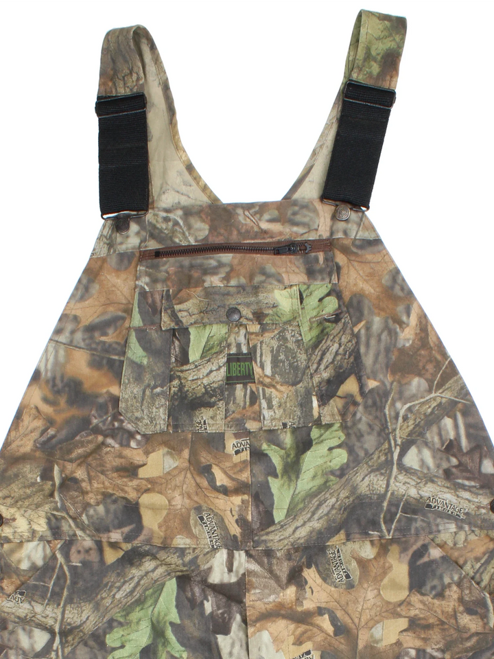 Vintage Liberty Camo Dungarees in green colourway with multiple pockets, branded buttons and the logo embroidered on the front/back.
