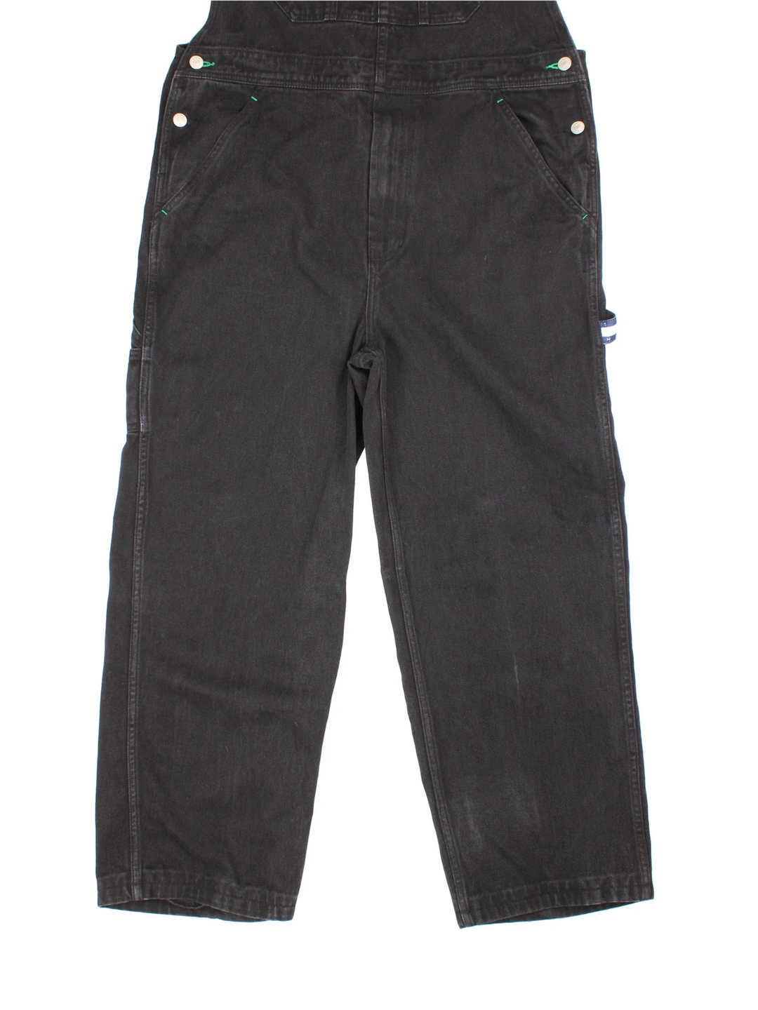 Tommy Hilfiger Dungarees in black colourway with multiple pockets, branded buttons and the logo embroidered on the front/back.