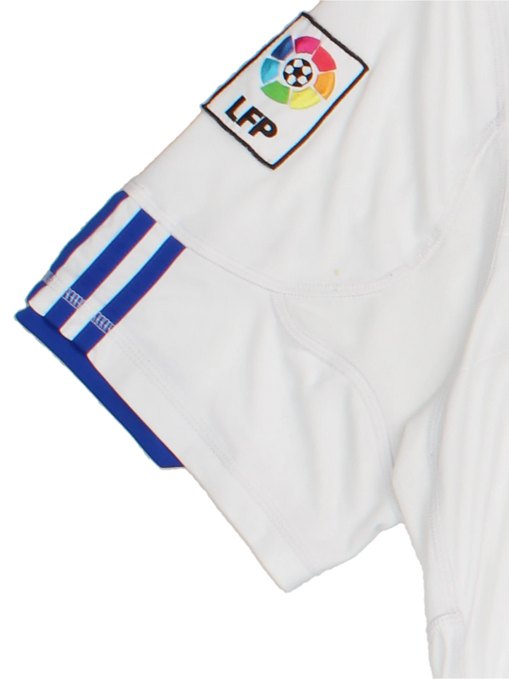 Real Madrid 2010/11  Football Shirt in the  home kit colourway, features embroidered logos and badge on the front.
