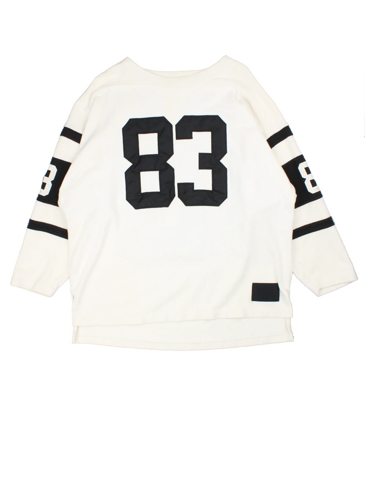 Hendricks NFL American Style Jersey in a tan colourway, features large number on the front with black stripe detailing on the sleeves and player name Hendricks #83 on the back.