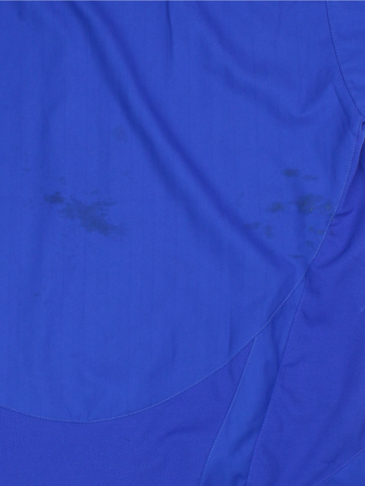 Manchester United 2005/06, Nike Football Kit in a blue, white and red colourway, signed by the players, V-neck and has logos printed on the front.