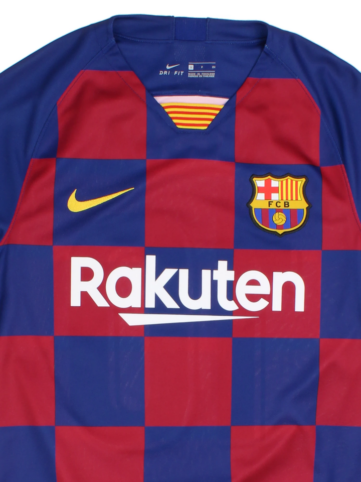 Barcelona Nike Football Shirt in the blue and red home kit colourway, features embroidered logos and badge on the front, and Messi number 10 printed on the back.