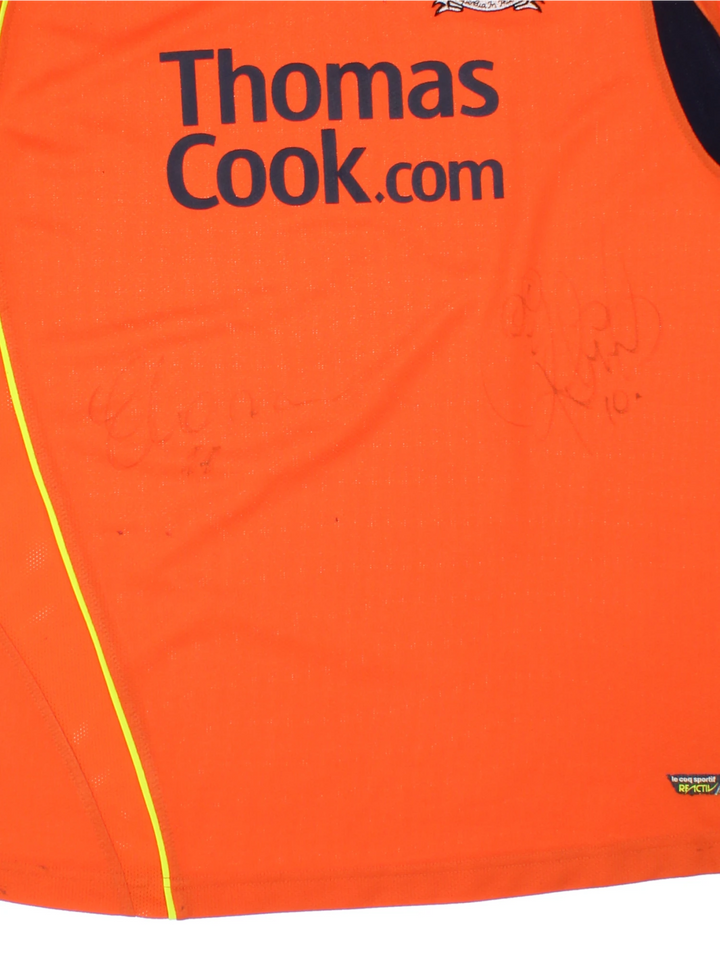 Manchester City 2008/09 Le Coq Sportif Football Shirt in the orange third kit colourway, features embroidered logo and badge on the front, and is signed by Elano number 11 and Robinho number 10.