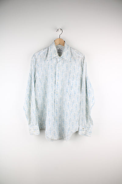 Vintage 1950's John Wells western shirt in off white. Features blue floral / paisley print and dagger collar 