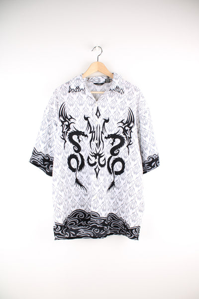 2000's button up cotton shirt in white by City Impact, features black a grey tribal tattoo style graphic all over