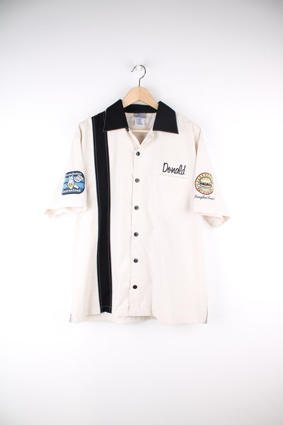 Disney's Donald's Diner bowling/vintage style shirt in tan, features embroidered spell-out badges and motifs 