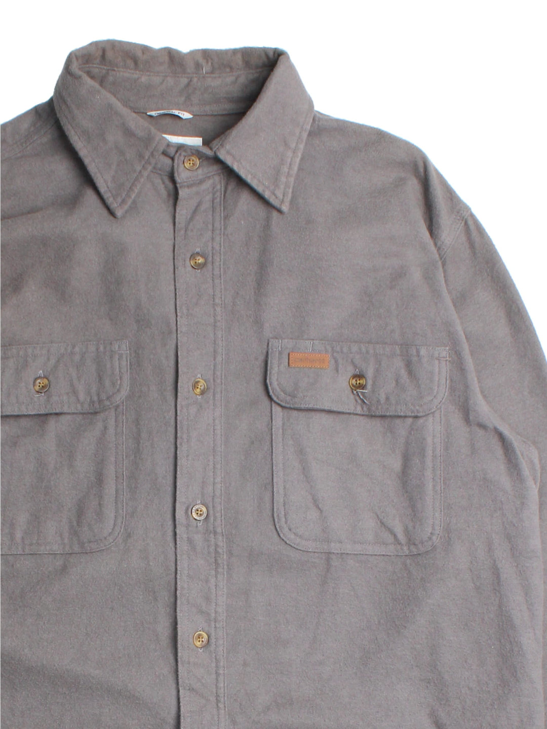 Carhartt Shirt in a grey colourway, button up with front patch pockets and leather branding tab.