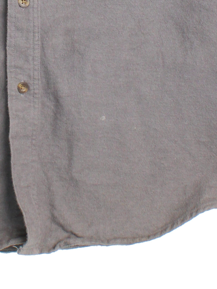 Carhartt Shirt in a grey colourway, button up with front patch pockets and leather branding tab.