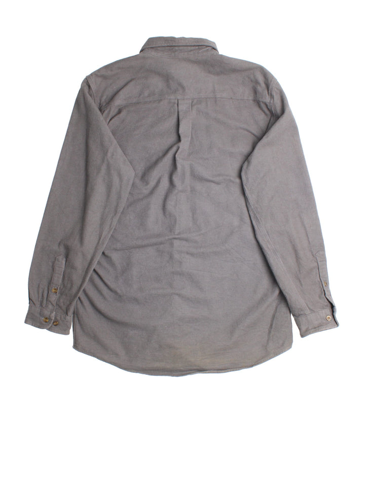 Carhartt Shirt in a grey colourway, button up with front patch pockets and leather branding tab.