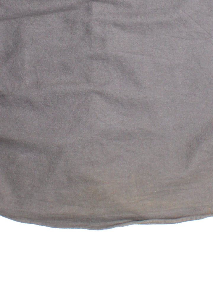 Carhartt Shirt in a grey colourway, button up with front patch pockets and leather branding tab.