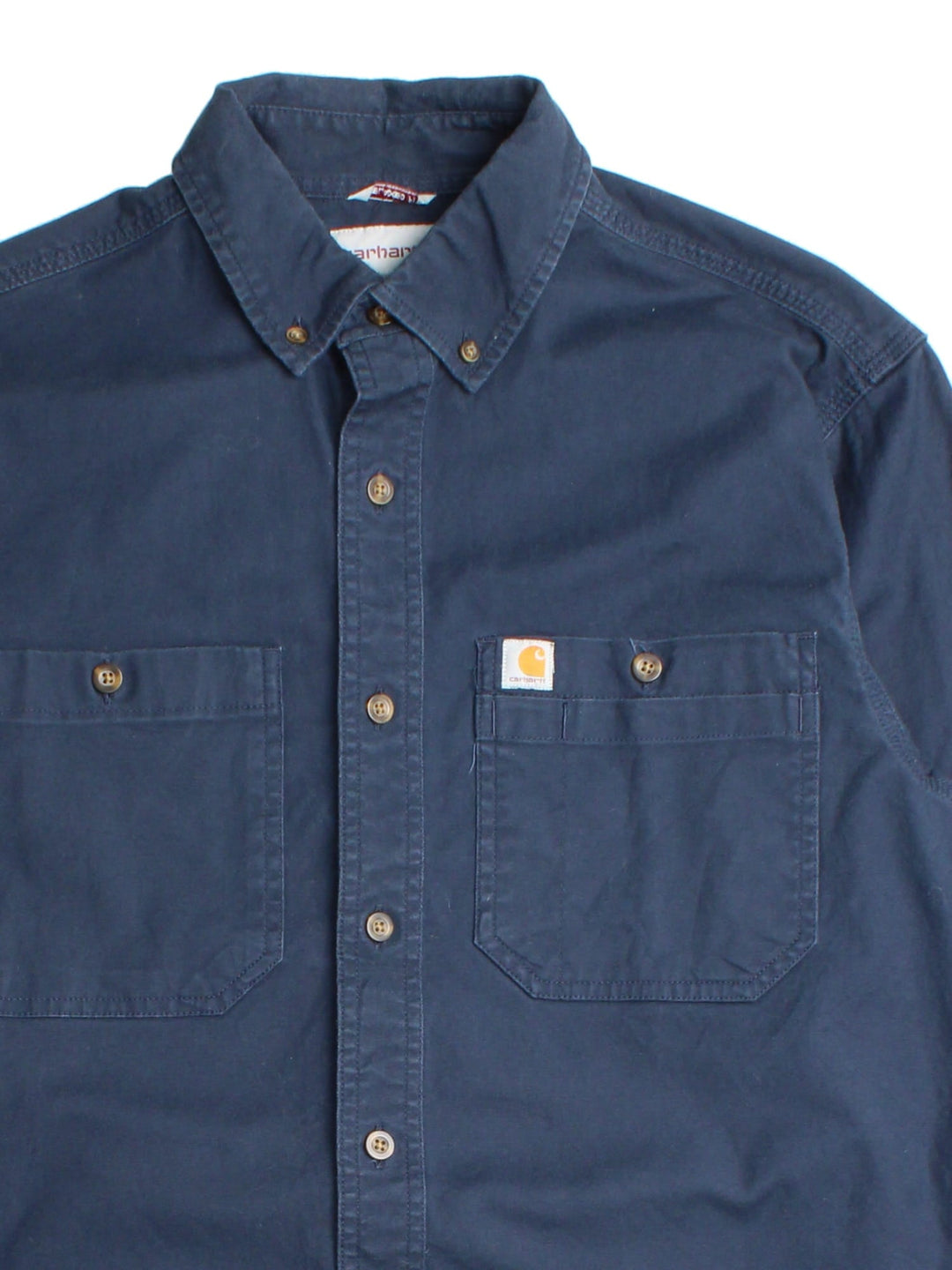 Carhartt Shirt in a blue colourway, button up with front patch pockets and embroidered branding.