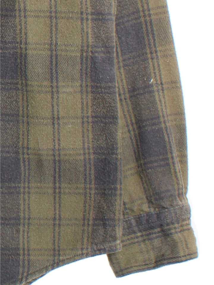 Carhartt Shirt in a green checked colourway, button up with front patch pockets and embroidered tab branding.