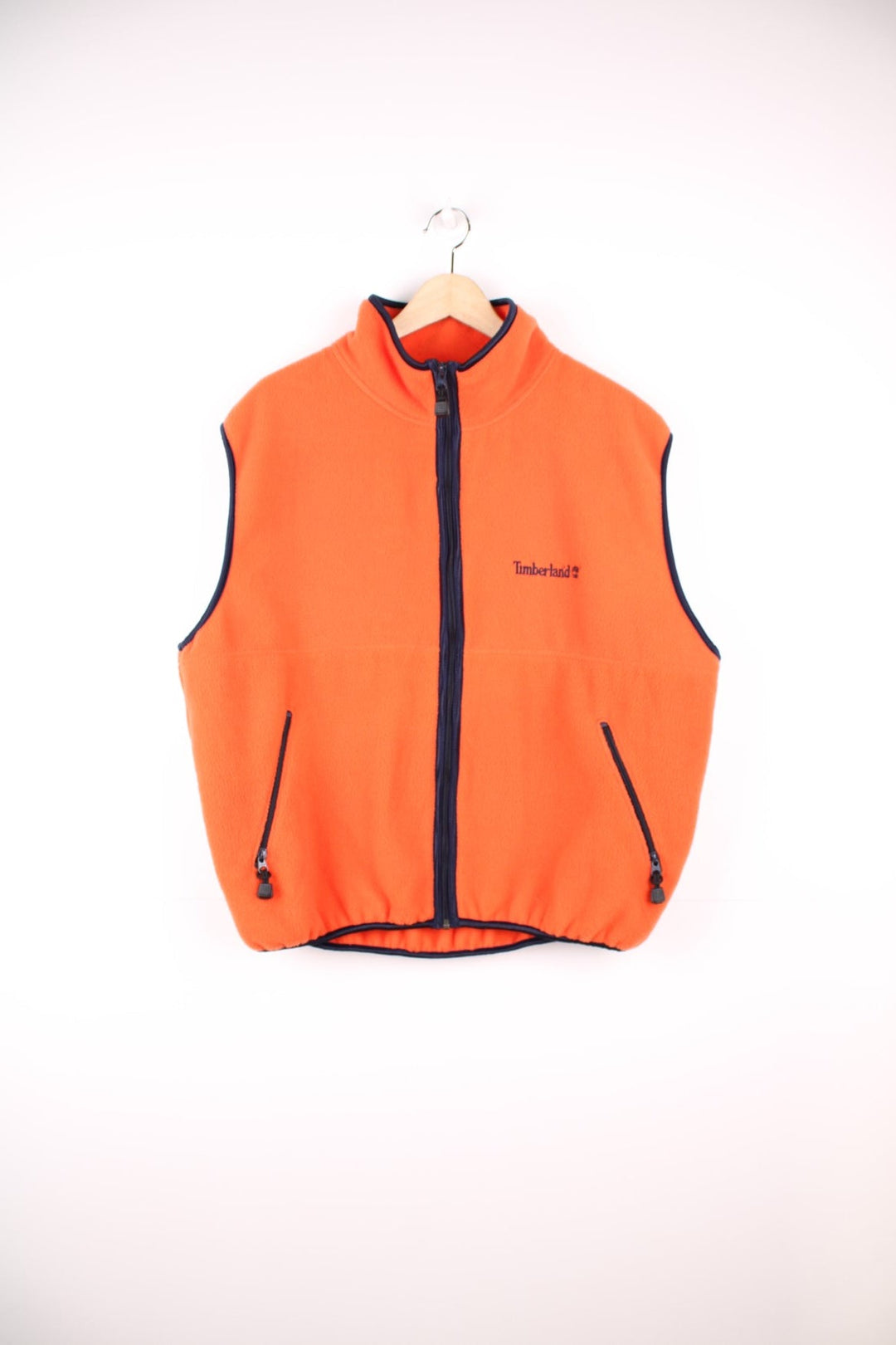 Orange Timberland zip-through fleece gilet with two side zip pockets and embroidered logo. 