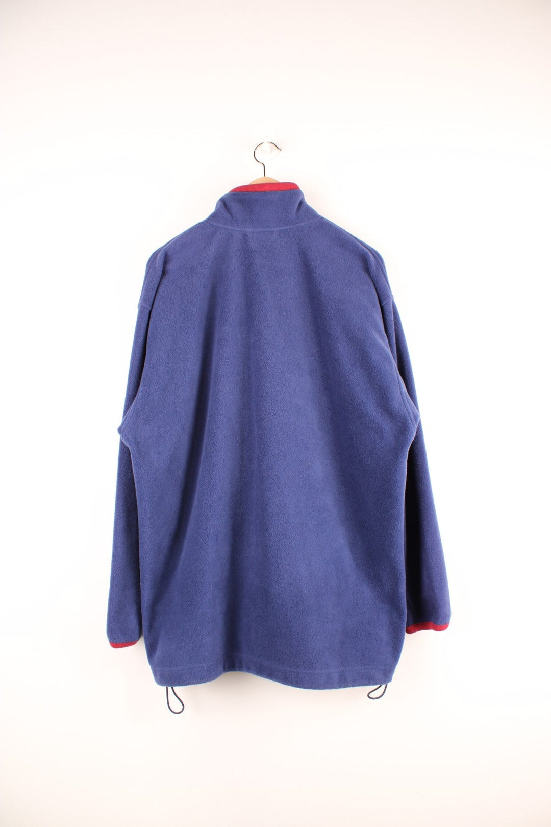 Dark blue Adidas zip-up fleece with red accents, two zipped pockets and an embroidered logo. 