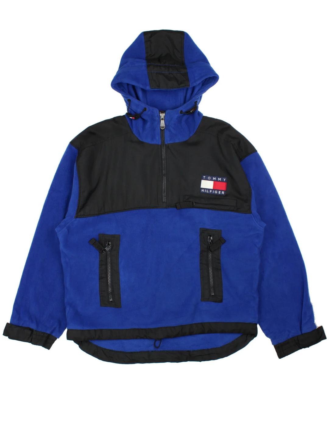Vintage Tommy Hilfiger Pullover Fleece in a blue colourway with black panelling. Half zip up closure and has multiple pockets, hooded, and the logo embroidered on the front.