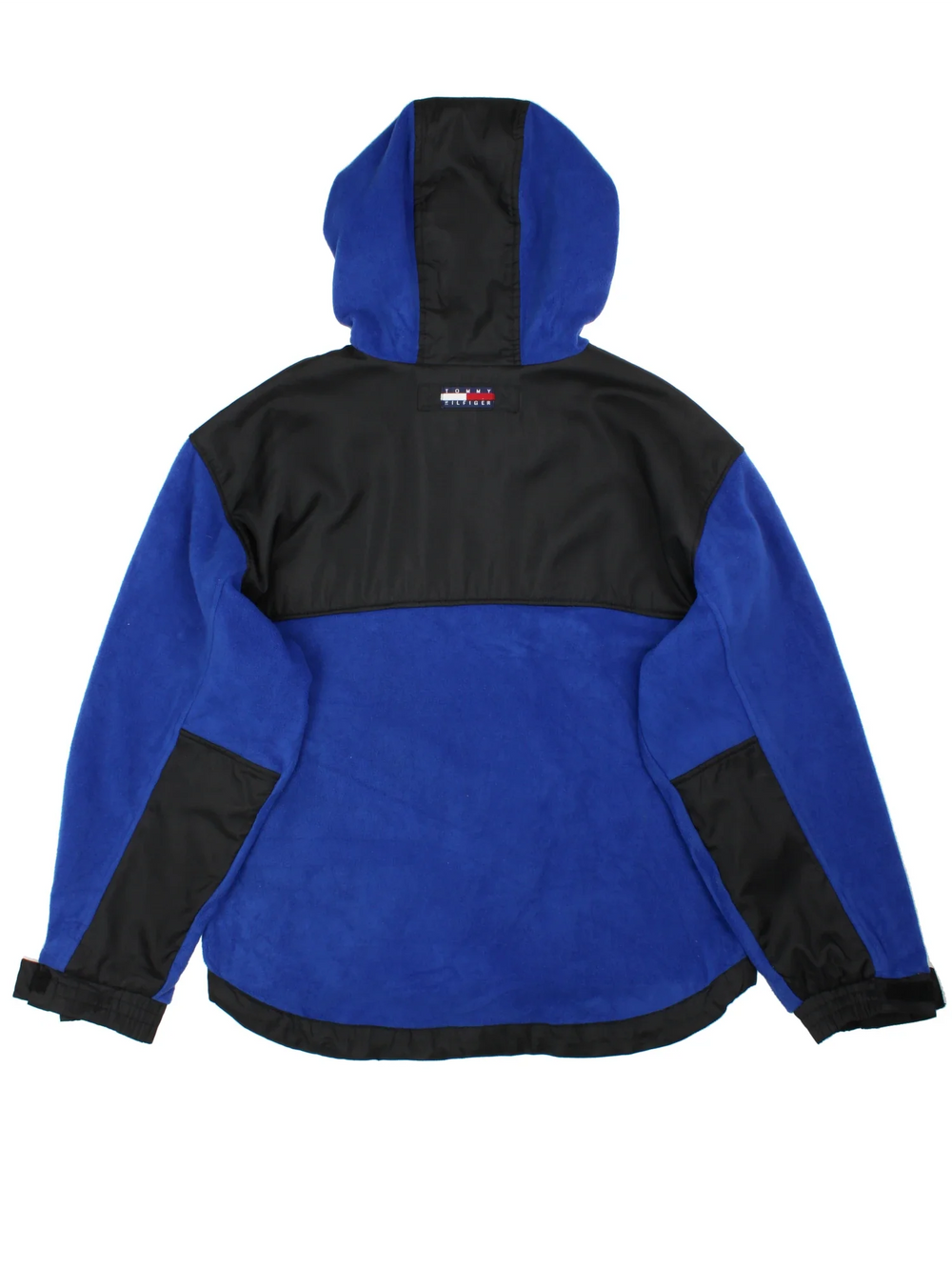Vintage Tommy Hilfiger Pullover Fleece in a blue colourway with black panelling. Half zip up closure and has multiple pockets, hooded, and the logo embroidered on the front.
