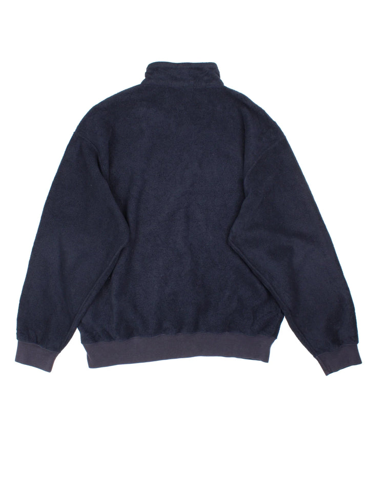 Ralph Lauren 1/4 Zip Fleece in a blue colourway. 1/4 zip up and has side pockets, and the logo embroidered on the front.
