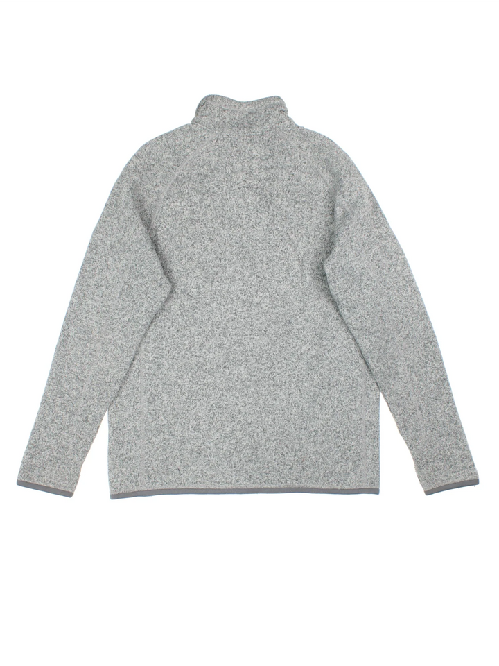 Patagonia Fleece in a grey colourway. 1/4 zip up closure and has a chest pocket, and the logo embroidered on the front.