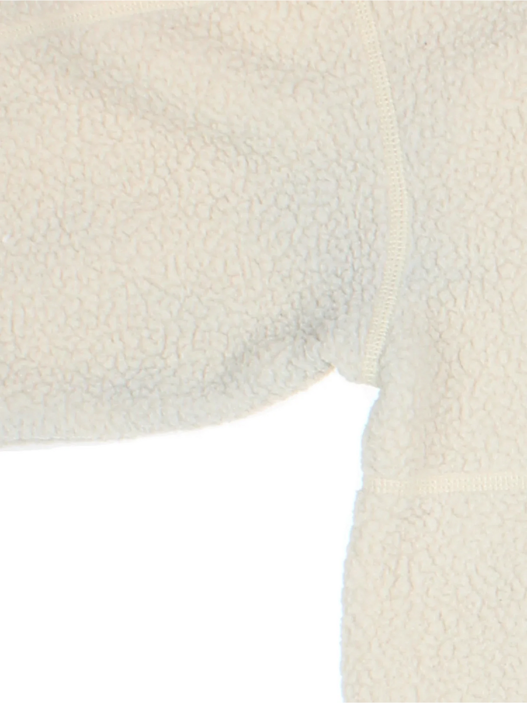The North Face Cragmont Fleece in a tan colourway. 1/4 button up and has side pockets, and the logo embroidered on the front.
