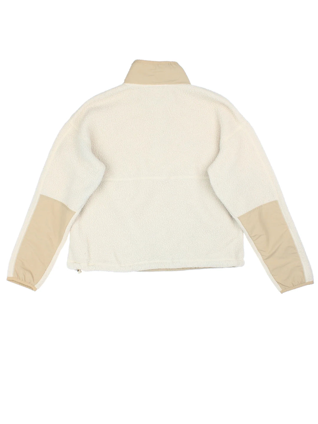 The North Face Cragmont Fleece in a tan colourway. 1/4 button up and has side pockets, and the logo embroidered on the front.